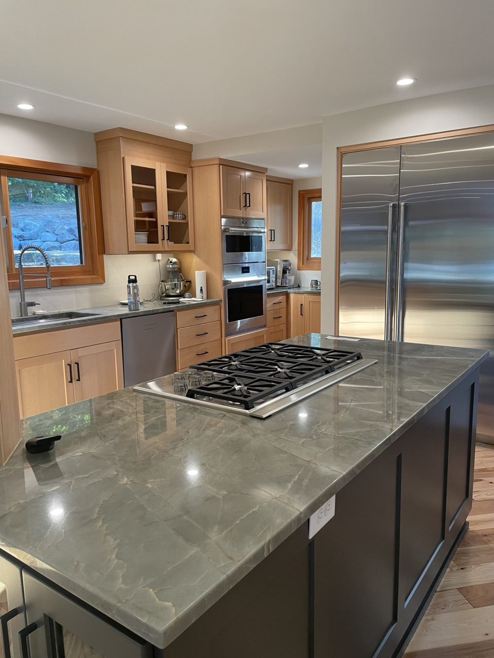 Custom kitchen remodel with island and stone countertops
