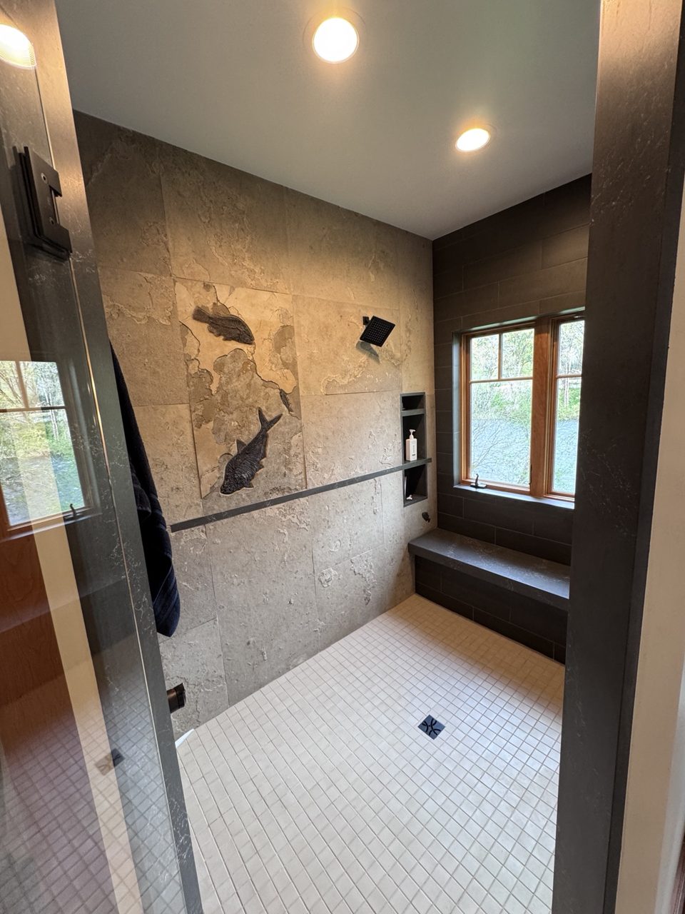 Custom tiled walk-in shower with built-in niches